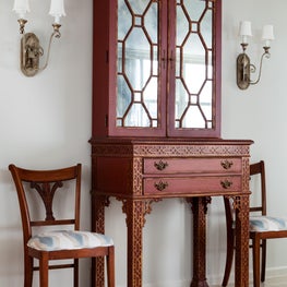  Wood tones and metal finishes add  texture to this monochromatic entry scheme.