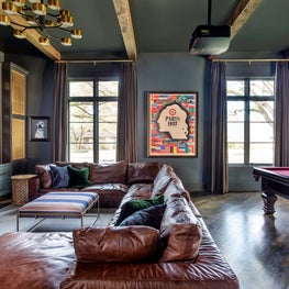 Portfolio: Handsome media room with pool table and ample seating for several guests