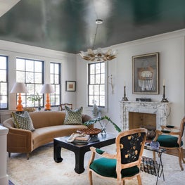 Formal Living Room with layered seating and rich accent colors on textiles