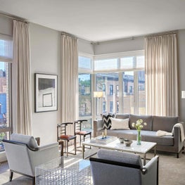 Living Room, Holly Hunt Grey Sofa, Conrad Drapery, Oscar Isberian Rug - Old Town Penthouse Project