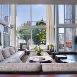 Leather & Manuel Canovas upholstered sofa with Andrianna Shamaris side tables