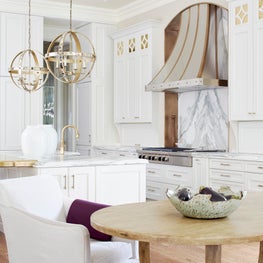 Kitchen with natural wood, marble, and brass accents