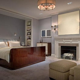 Upper East Side Master Bedroom, fireplace that exudes tranquility, blue palette.