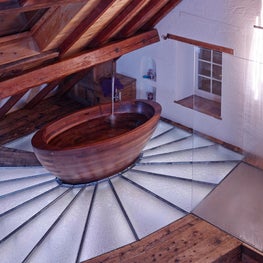 Swiss Chalet Master Bath with Freestanding Tub and Glass Shower Enclosure