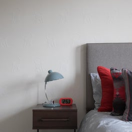 Pop of colour, cheeky monkey wallcovering makes for cool detailing 