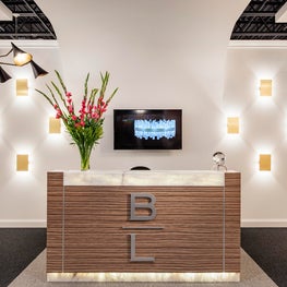 Philadelphia Showroom Design with Custom Front Desk and Wall Mounted Lighting