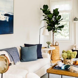 Contemporary family room with sectional sofa in blue and white