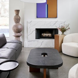 Portfolio: Contemporary sitting room with boucle chair and pops of color