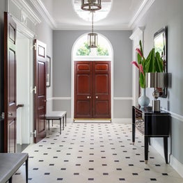 A high gloss ceiling and classical limestone flooring in a Palm Beach Landmark