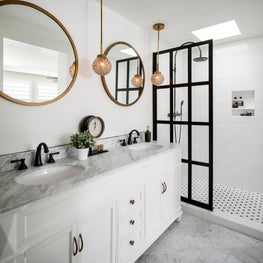 Contrast and classic elements bring drama and timelessness to this master bath.