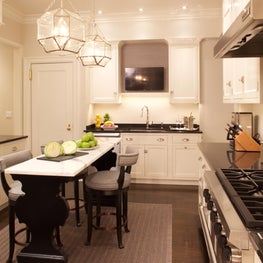 Manhattan kitchen, White kitchen with marble island and glass pendant fixture