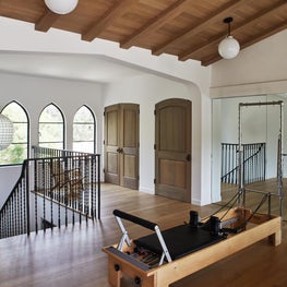 Large gym with fumed oak ceiling and floors.