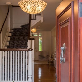 Entry in historic home with shell bowl chandelier and bench-Sophia Shibles