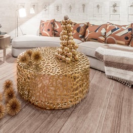 Festive room with a curved sofa created for a holiday house