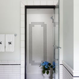 Lake Geneva Bathroom. Black & white vintage style mini hex shower.