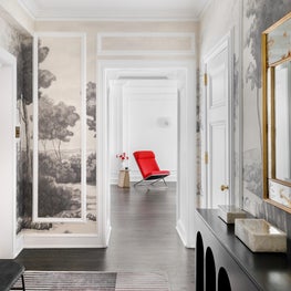 Foyer view into Living Room featuring a reupholstered Ward Bennett Scissor chair