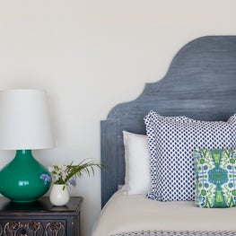 Bright bedroom blending the nature of the seaside with the indoors.