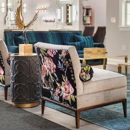 Philadelphia showroom design with contrast fabrics on glamorous slipper chairs