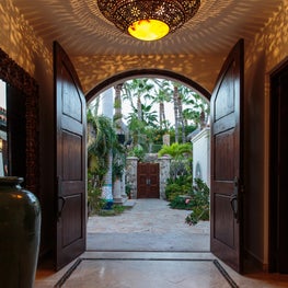 Handcrafted custom light fixtures exude beautiful shadows and patterns at dark.