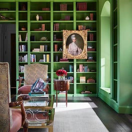 Library Featuring Green Painted Bookshelves