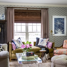 Layered living room with asian accents antiques wallpaper woven wood lucite