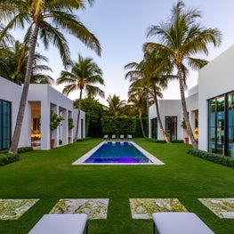 A long lap pool defines the garden between main house and pool house