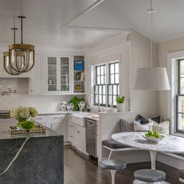 Kitchen and Breakfast Nook with Marble Island and Built-In Bench Seating