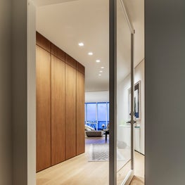  A minimalist foyer guides you through the main living areas
