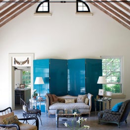 Living room with blue lacquer screen and European antiques in a Hampton's summer house