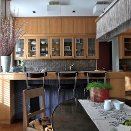 Kitchen renovation with custom cerused oak cabinets and statement chandelier