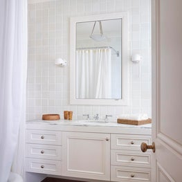 Ann Sacks tile & a custom floating vanity with a Royal Danby marble countertop