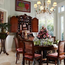 Walls were painted a trompe l’oeil faux bois pattern to resemble paneling. 