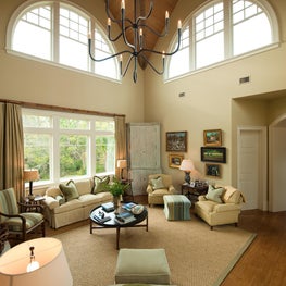 Vaulted Great Room with Natural Wood Ceiling, Arched Windows and Iron Chandelier