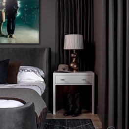 Beautiful, moody hues envelop the primary bedroom of Mountain Lane creating the perfect cozy retreat.