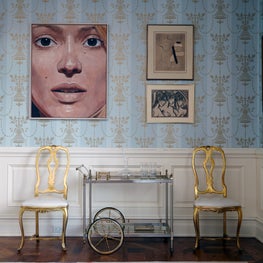 Greenwich Whimsy: colorful custom rug, gold vintage chairs, bar cart and art