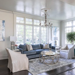 Living Room Angle Shot. Antique Chandelier and tons of natural light 