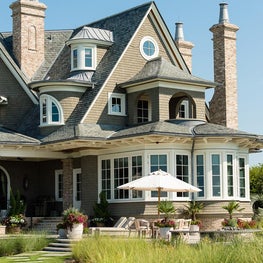 Ocean Front Elevation with Covered Porch, Raised Patio and Brick Chimneys