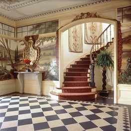 Grand staircase into formal entry. 