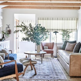 Living Room with Leather Sofa and Vaulted Ceiling