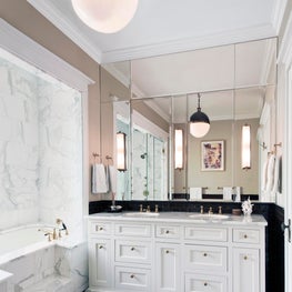 Classic Bathroom with Checked Floor and Brass Fixtures, Mirrored Wall