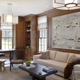 Living room with stain grade paneled walls