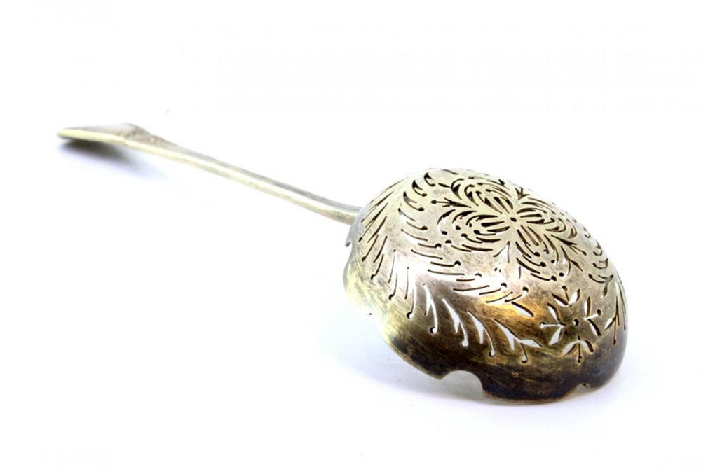 Silver Dusting Spoon with Scalloped Edges and Raised Handle