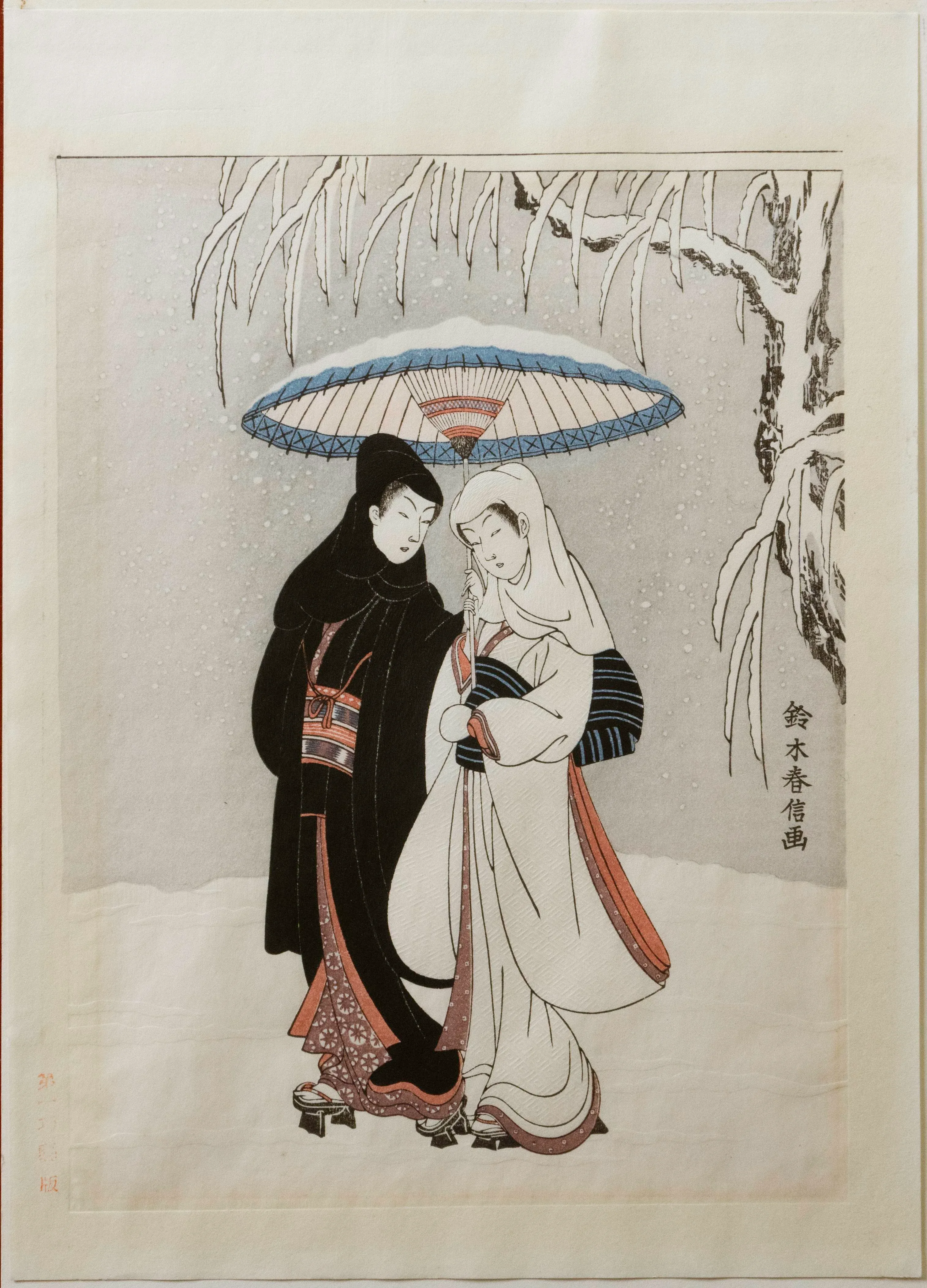 young-couple-walking-in-a-snow