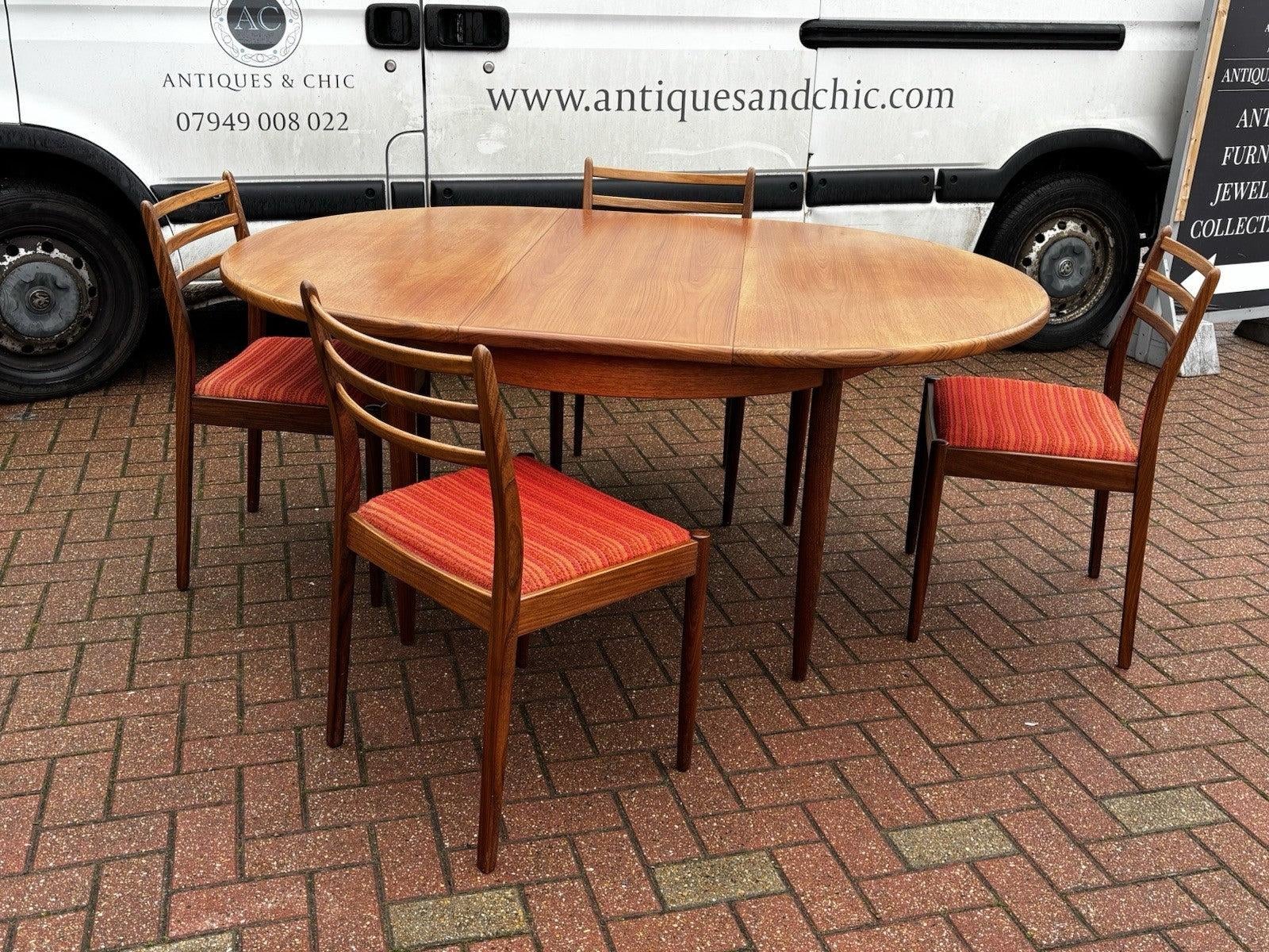 Mid-Century Modern Circular Extendable Dining Table and Chairs