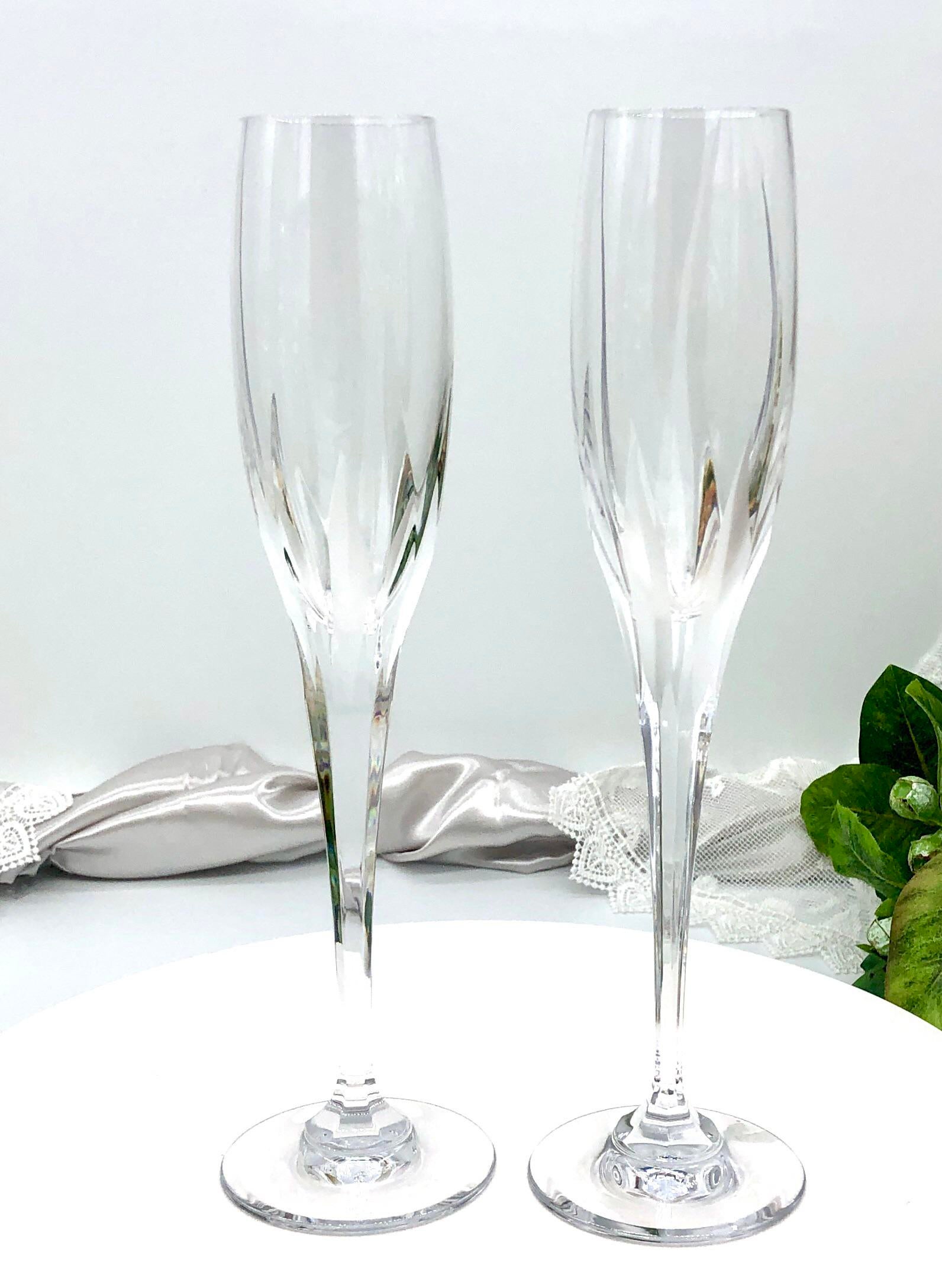 https://chairish-prod.freetls.fastly.net/image/product/master/59b08ef6-b4b3-4439-9f57-27eca53c2df7/champagne-flutes-flame-damore-mikasa-cut-crystal-wedding-toasting-glasses-2-3194