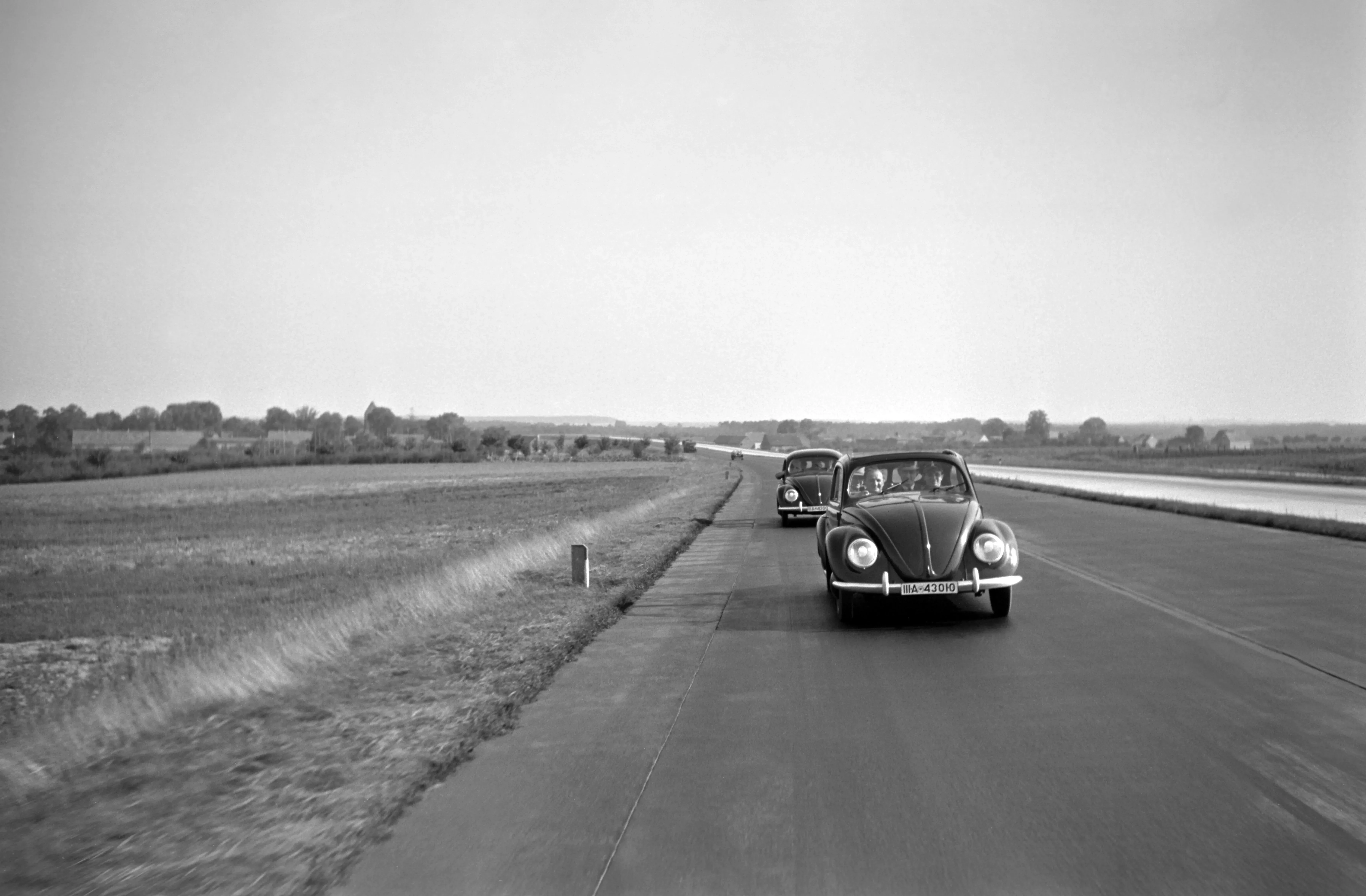 Two Volkswagen Beetles on the Highway, Germany, 1938 main image 2
