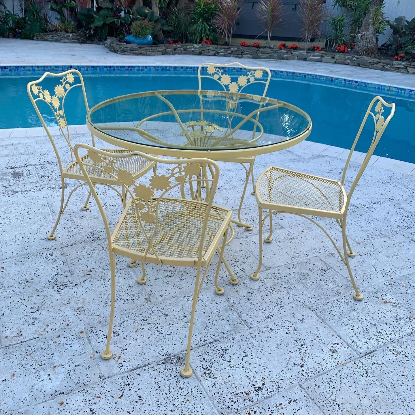 Woodard wrought iron table and chairs deals
