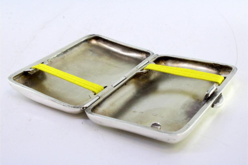 Curved Silver Cigarette Case with Spring-Loaded Hinged Lid