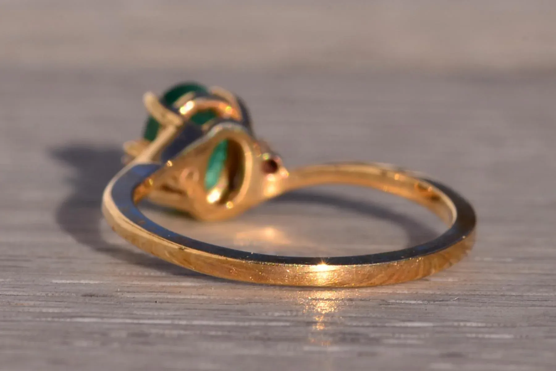 The 178th Avenue: Oval Natural Emerald and Diamond Bypass Ring in Yellow Gold