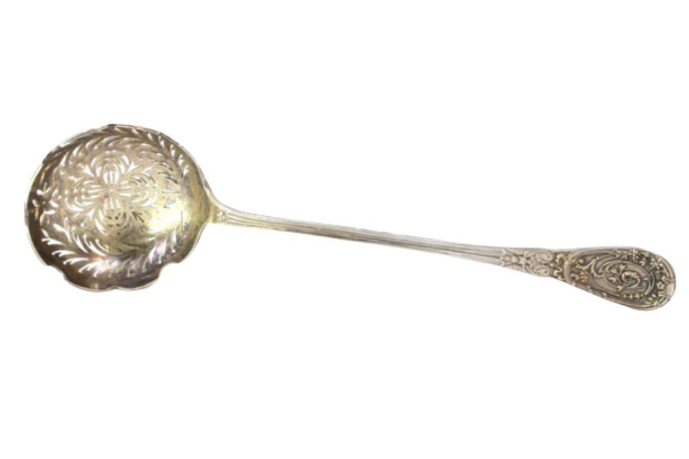 Silver Dusting Spoon with Scalloped Edges and Raised Handle